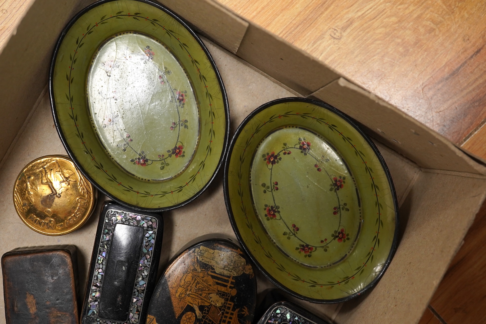 A collection of objects of vertu including snuff boxes, a pair of miniature oval trays, a silver mounted clock and photo frame, etc.